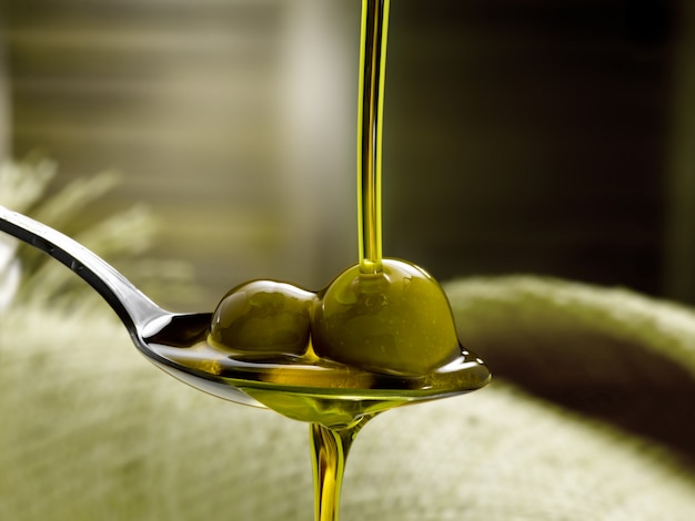 spoon with extra virgin olive oil