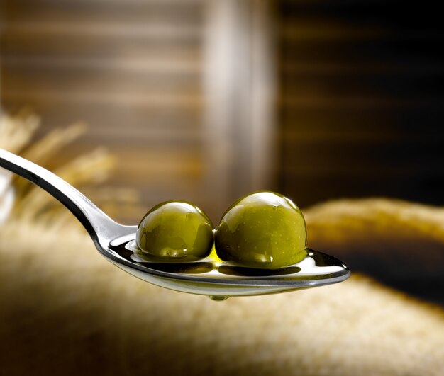 spoon with extra virgin olive oil