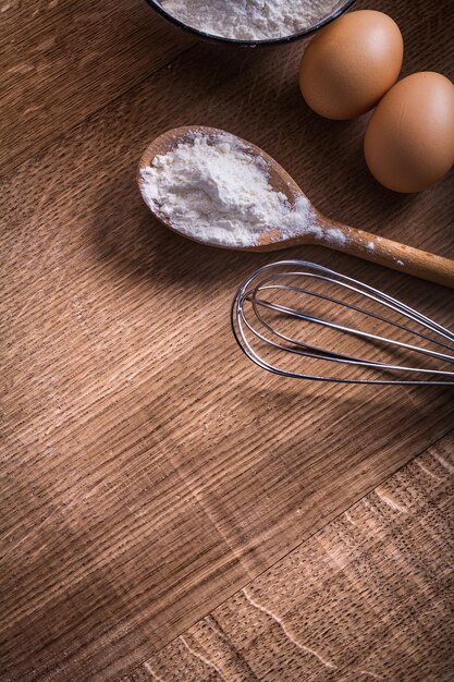 Spoon with flour corolla eggs