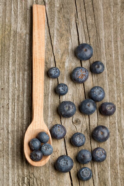 Spoon with fresh blueberries