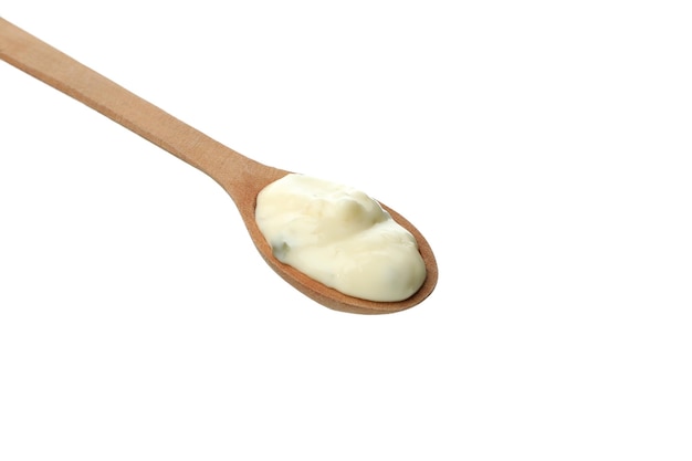 Spoon with mushroom sauce isolated on white background