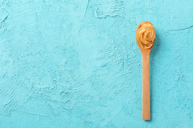 Spoon with peanut butter, top view