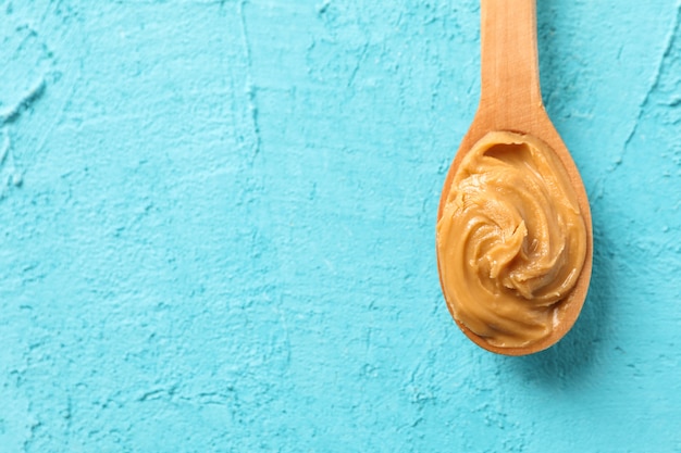 Spoon with peanut butter, top view