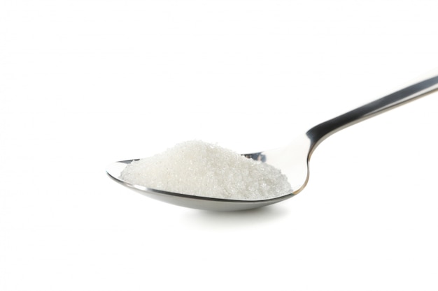 Spoon with sugar isolated on white background, close up