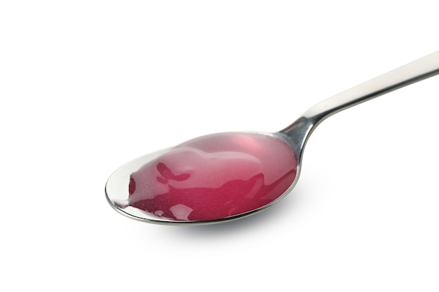 Spoon with syrup isolated