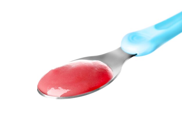 Spoon with tasty baby food isolated on white