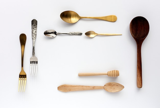 Spoons and forks on white 