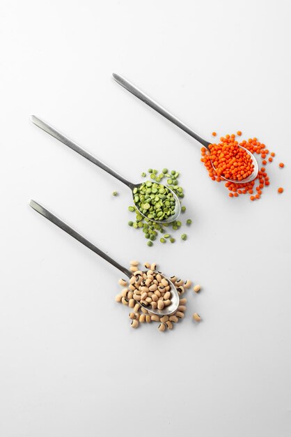 Spoons on white background with ancient grain food useful food for those who are on a diet and watch