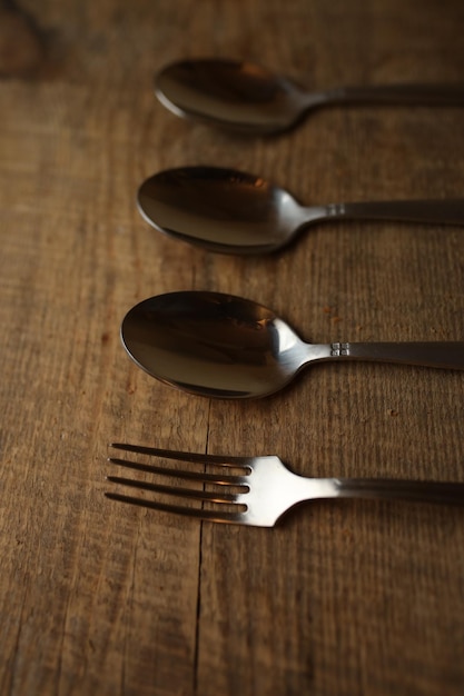 Spoons on a wooden background Spoons with a fork on a wood background