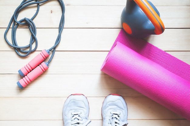 Sport background with copy space. Selfie of feet fitness woman on wooden floor. 