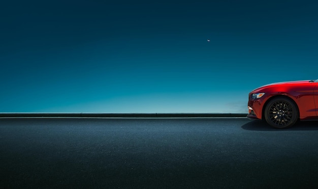 Photo sport car parked on road side with night sky background