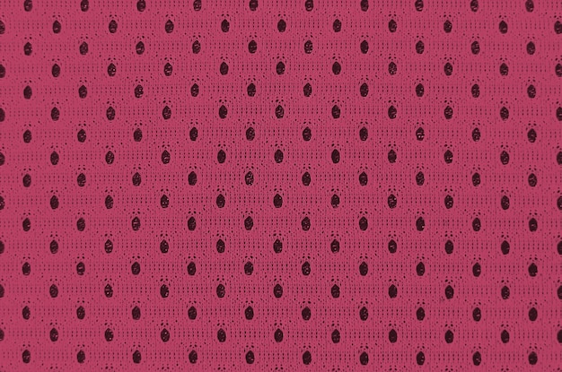 Sport clothing fabric texture background top view of cloth textile surface image toned in viva magen