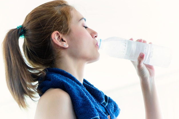 Sport fitness drinking water after workout