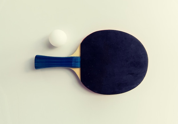 sport, fitness, healthy lifestyle and objects concept - close up of ping-pong or table tennis rackets with ball