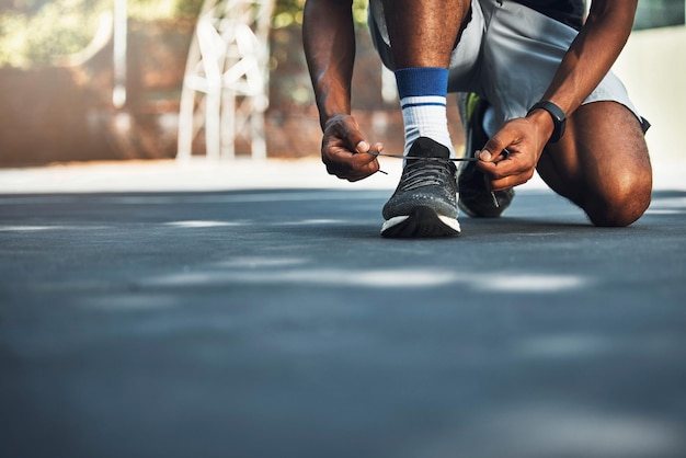 Sport fitness and shoes of runner before exercise and morning cardio in city lace tie feet and closeup Health wellness and sneakers of man before running outdoor for training health and workout