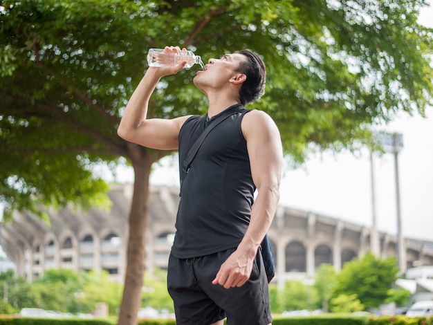 Sport man is drinking water