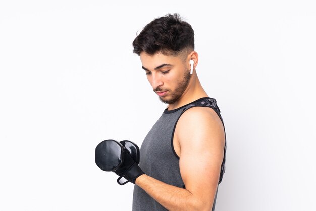 Sport Man isolated on white wall making weightlifting