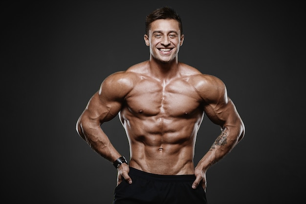 Sport muscular fitness man working out at the gym