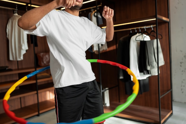 Sport person training with hula hoop