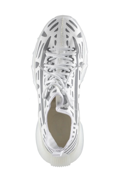 Photo sport shoes white fabric trainers with gray reflective stripes