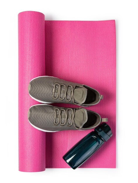 Photo sport shoes and yoga mat