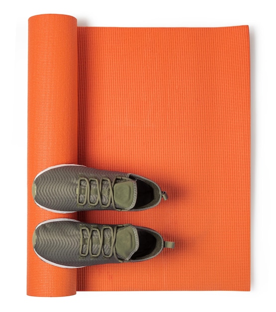 Premium Photo Sport shoes and yoga mat