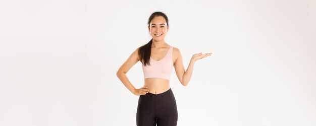 Sport wellbeing and active lifestyle concept portrait of cheerful attractive asian fitness coach fem