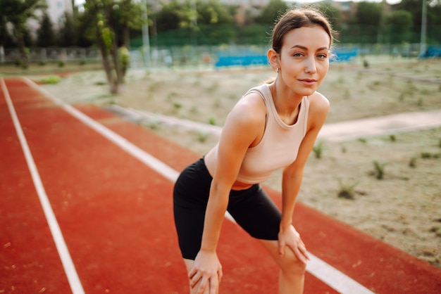 Sport woman doing exercises outdoors in morning Active life sports training healthy lifestyle