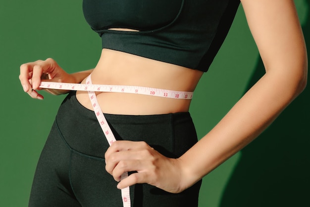 Sport woman on green background