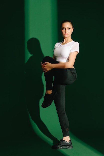 Sport woman on green background