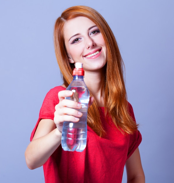 Sport woman with bottle.