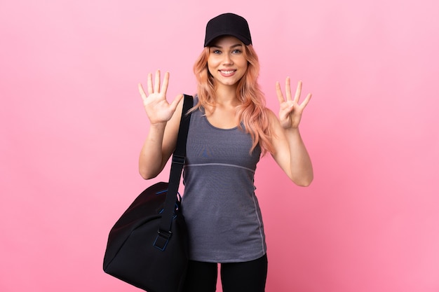 sport woman with sport bag counting nine with fingers