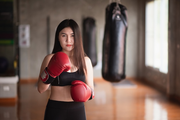 Sport women training boxing in the gym