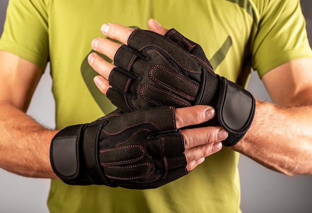 Sport workout gloves closeup on male hands for gym training