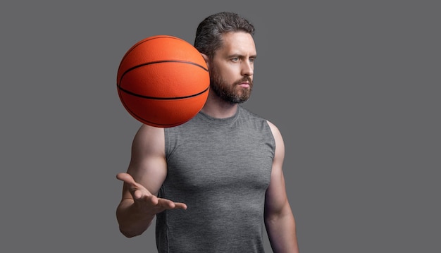 sporting athlete man basketball player in studio photo of athlete man basketball player with ball athlete man basketball player in sportswear athlete man basketball player isolated on grey