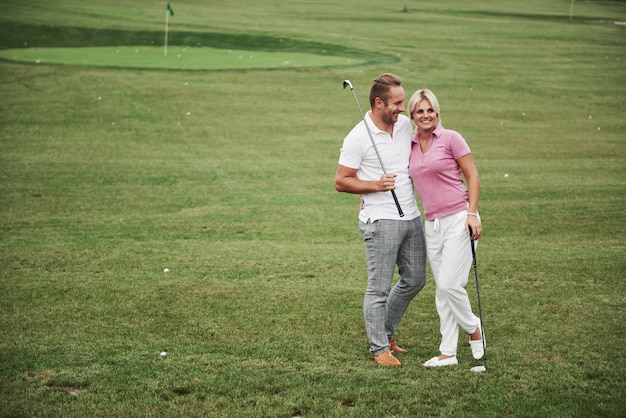 Sportive couple on a golf course