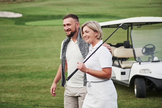 Sportive couple on a golf course