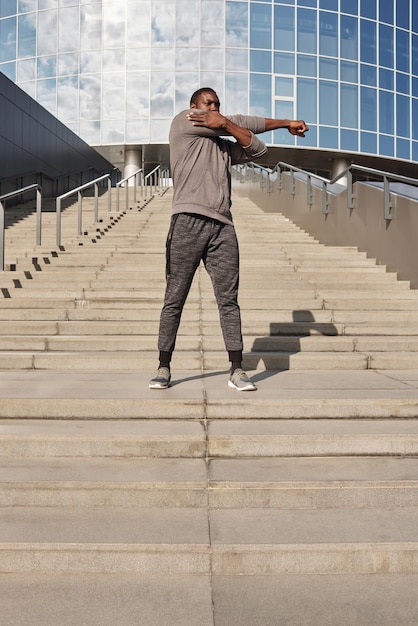 Sportive Man Stretching Outdoors