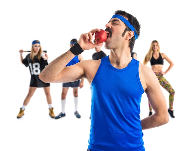 Sportman eating an apple