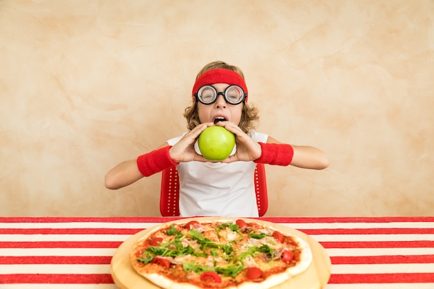 Sportrsman nerd child eating superfood