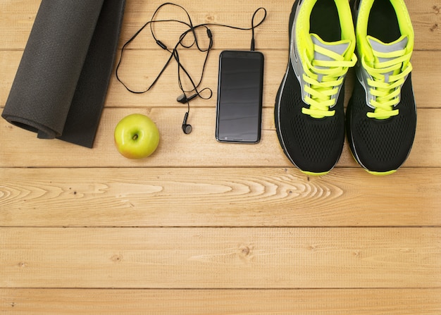 Sports accessories for fitness on the wooden floor.