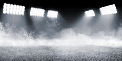 Photo sports arena with concrete floor with smokes and spotlights background