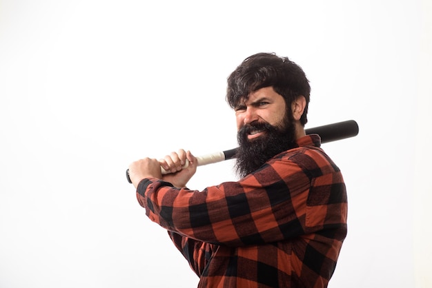 Sports and baseball training sport equipment angry man in plaid shirt ready to swing sport training