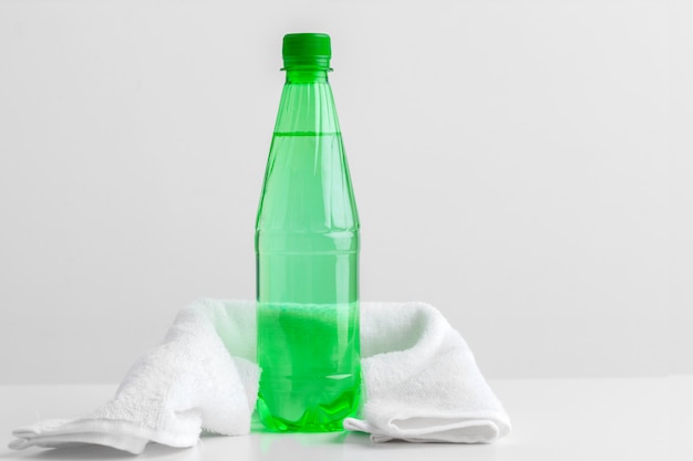 Sports bottle with towel on light 