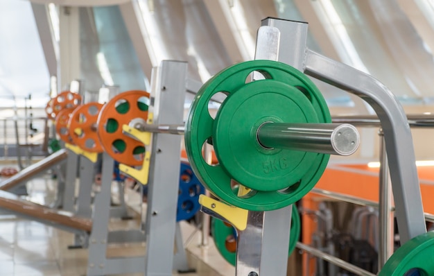 Sports equipment and barbells in the gym