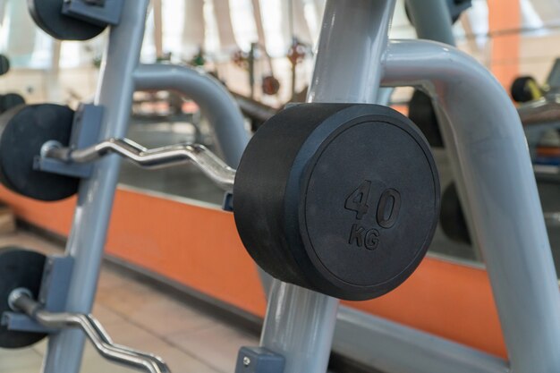 Sports equipment and barbells in the gym