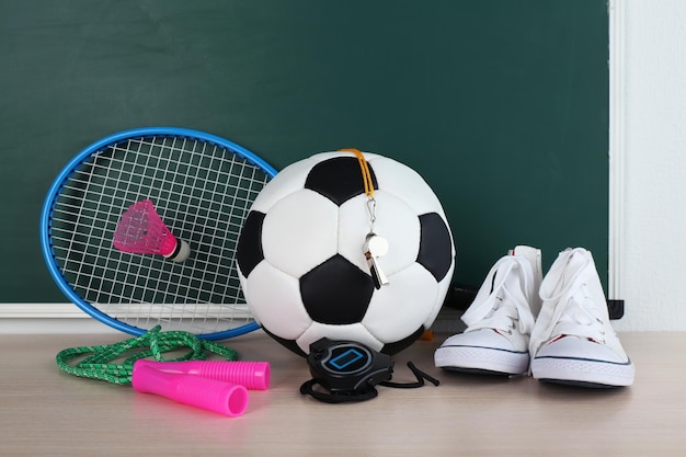 Photo sports equipment on blackboard background