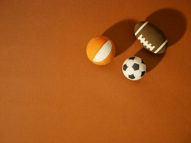 Sports equipment including a american football, soccer ball and\
basketball