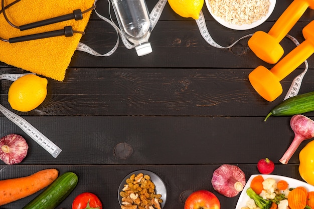 Photo sports equipment and vegetables on a white background