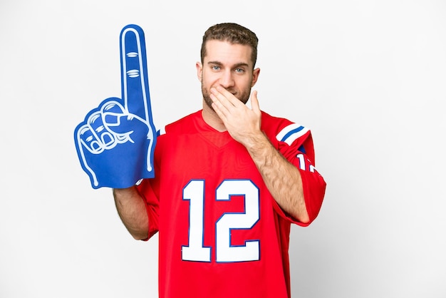 Sports fan man over isolated white background happy and smiling covering mouth with hand